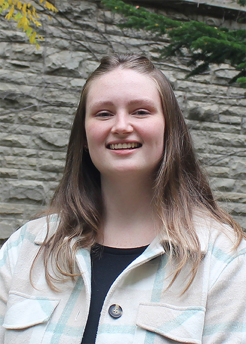 Head shot of Chemistry student Kristen Perry, a white woman with gold and brown shoulder-length hair.