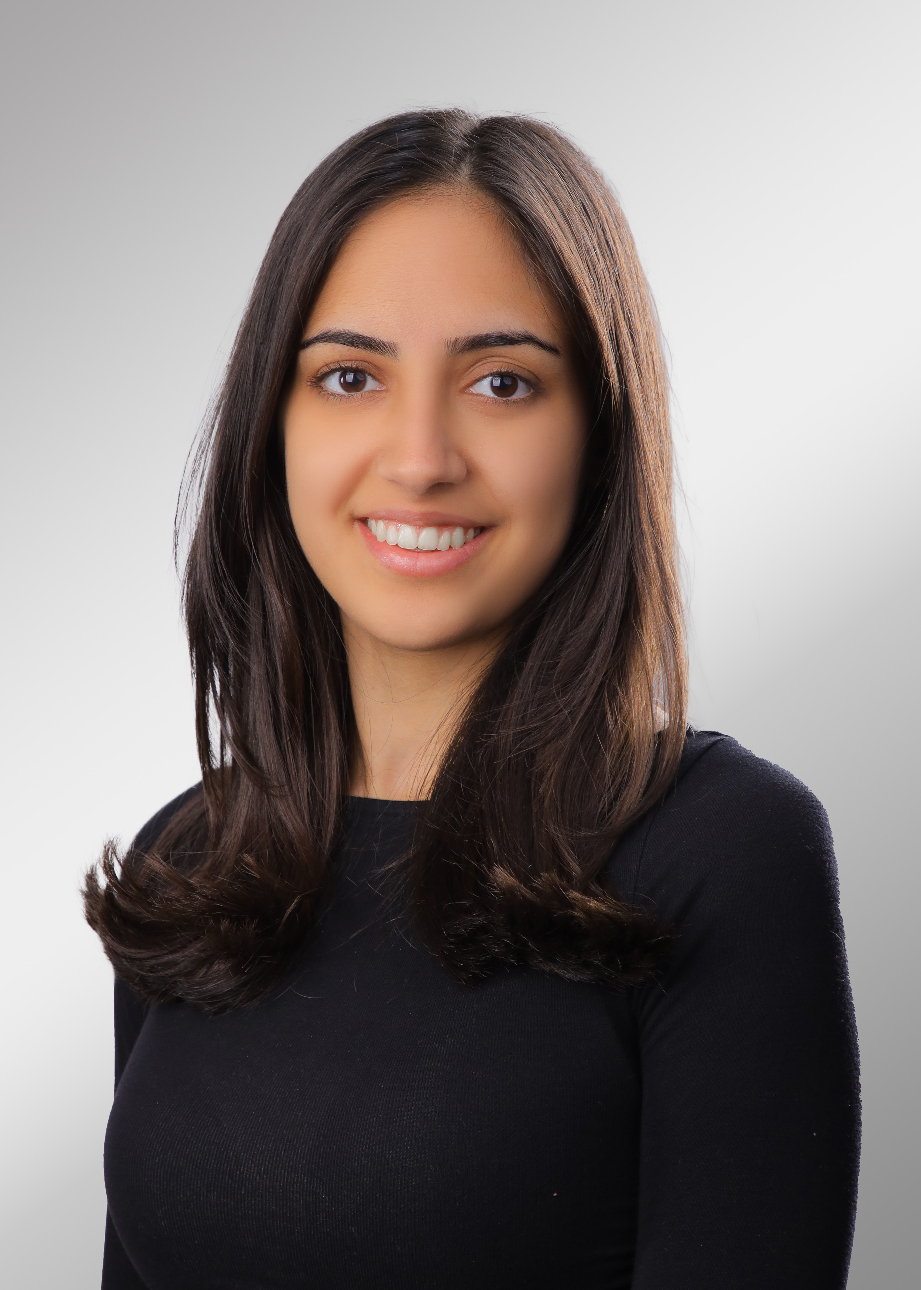 Head shot of chemistry student Sara Ziadat, a brown woman with shoulder-length brown hair.