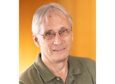 Head shot of Professor Jon Abbatt, a white man with white hair and glasses.