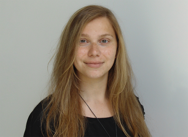 Head shot of Professor Aya Sakaya, a white woman with shoulder-length blonde hair.